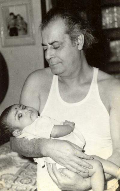 Dadaji cradles his granddaughter Irene